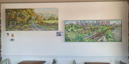 2 Paintings on Wall of Ruralscape and Urbanscape